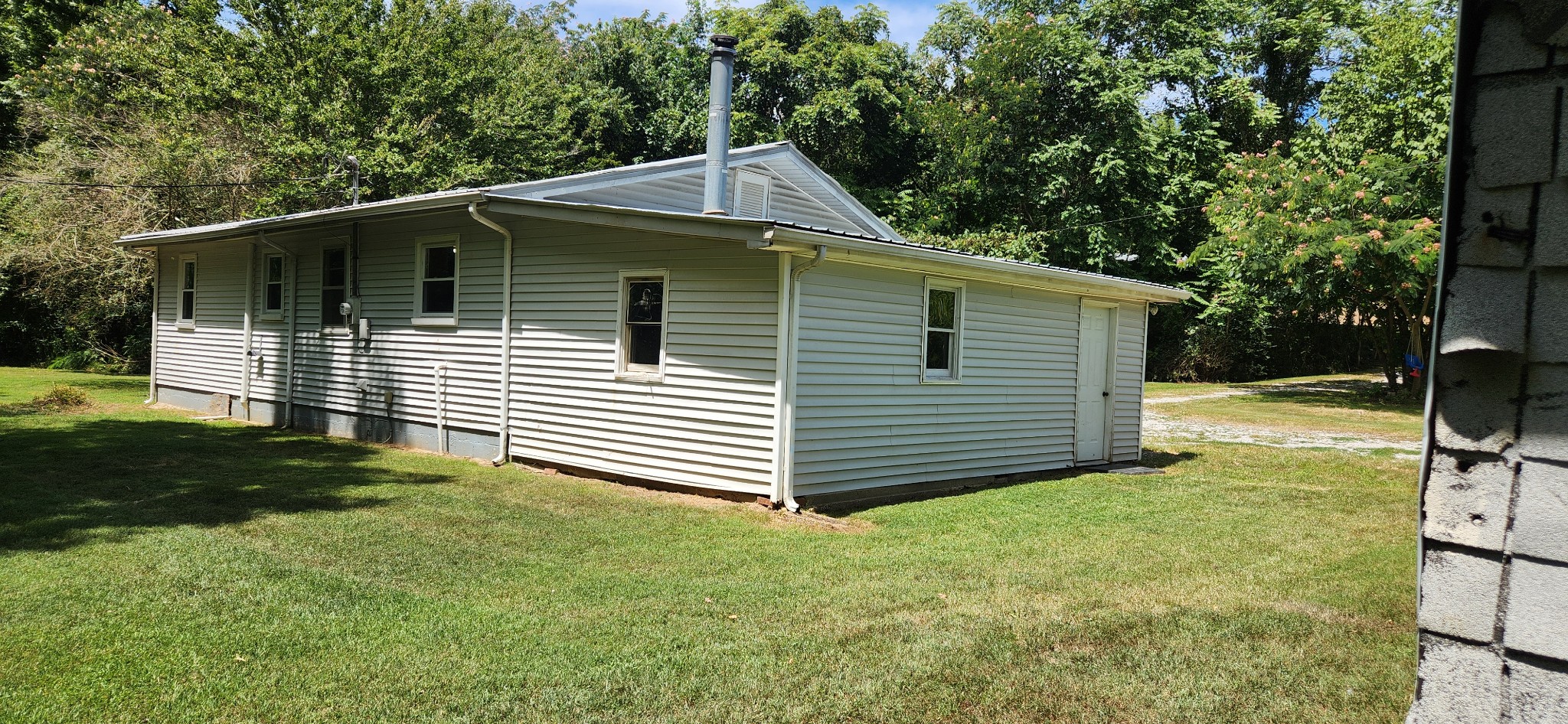 259 Brushy Road Centerville, TN 37033 - Photo 6 of 17 Looking at back of home from behind the shed.