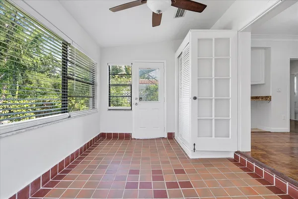 a view of an empty room with a window