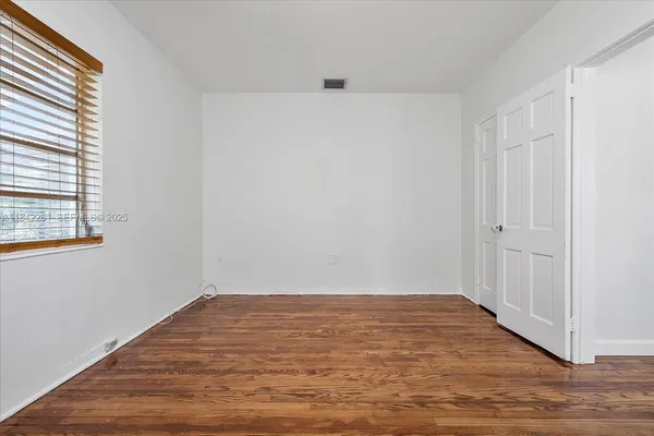a view of a bathroom from a hallway