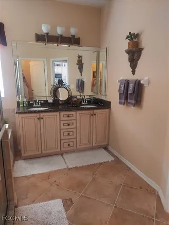 a kitchen with stainless steel appliances a sink and cabinets