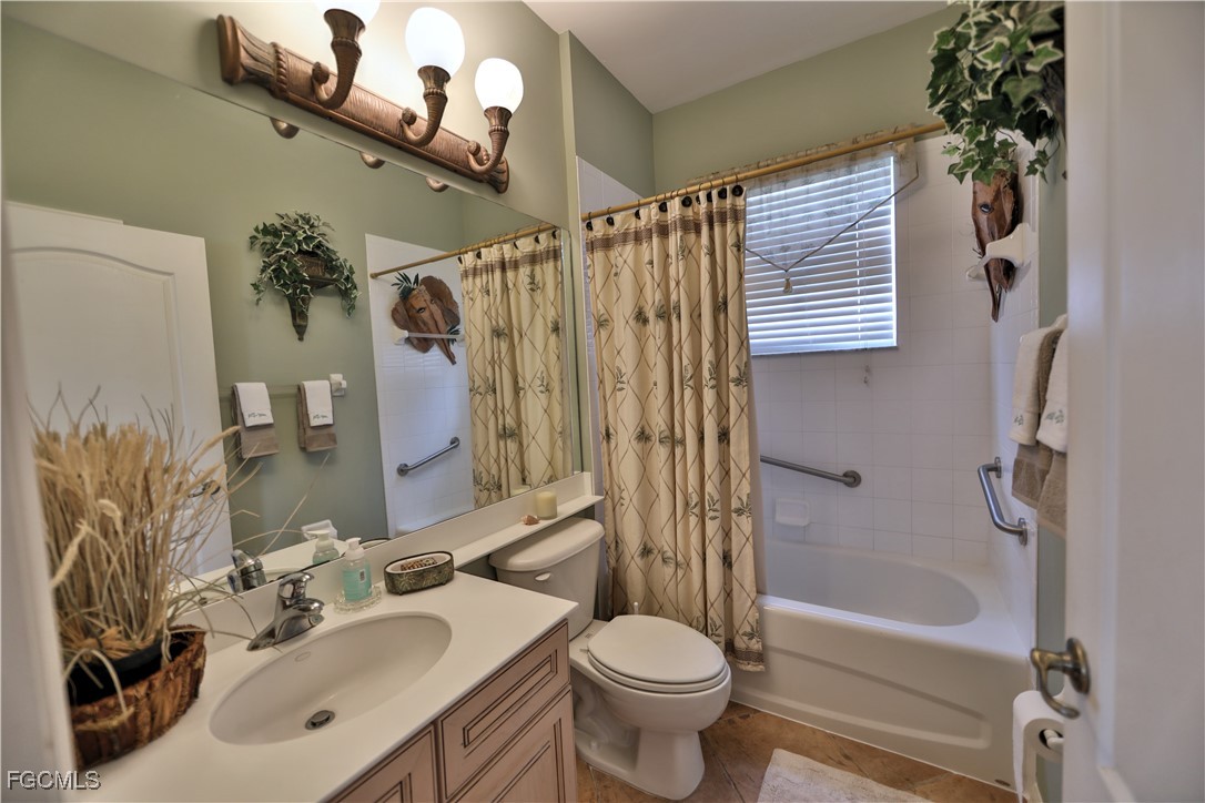 15022 Balmoral Loop Fort Myers, FL 33919 - Photo 16 of 27 a bathroom with a sink toilet and shower