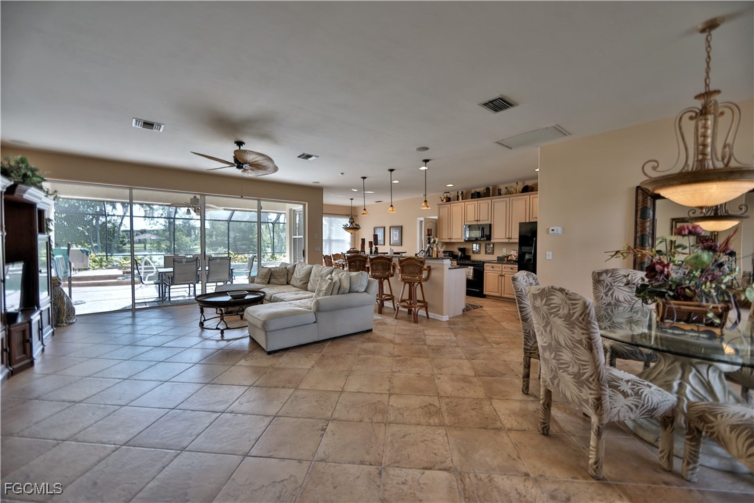 15022 Balmoral Loop Fort Myers, FL 33919 - Photo 19 of 27 a living room with furniture and a large window