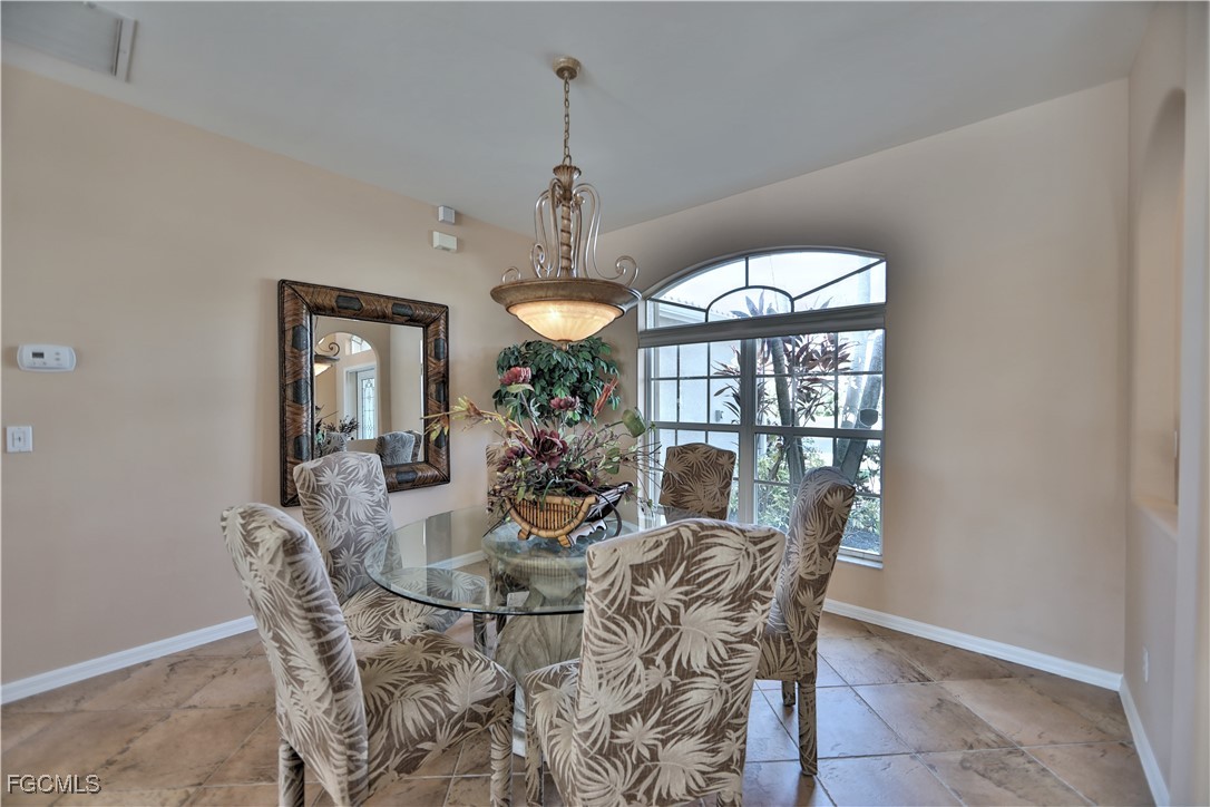 15022 Balmoral Loop Fort Myers, FL 33919 - Photo 22 of 27 a view of a dining room with furniture window and outside view