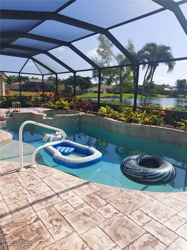 15022 Balmoral Loop Fort Myers, FL 33919 - Photo 3 of 27 a view of a patio with table and chairs under an umbrella