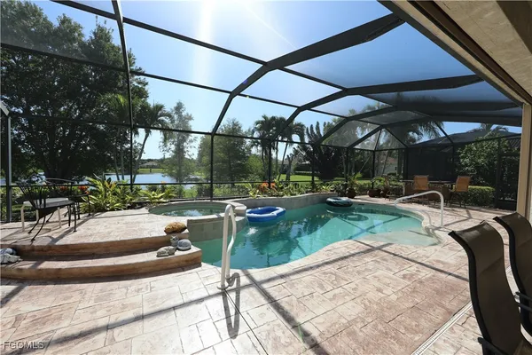 a view of a swimming pool with a patio