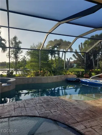 a view of a lake with a table and chairs
