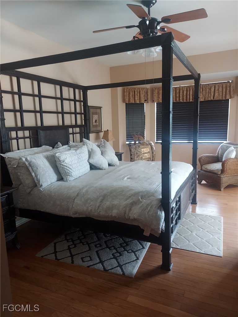 15022 Balmoral Loop Fort Myers, FL 33919 - Photo 8 of 27 a bedroom with furniture and a window