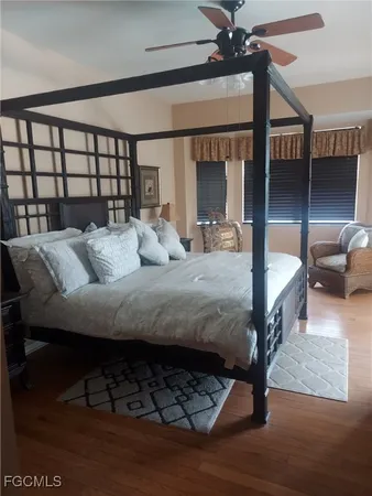 a bedroom with furniture and a window