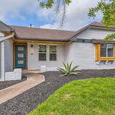 a front view of a house with garage