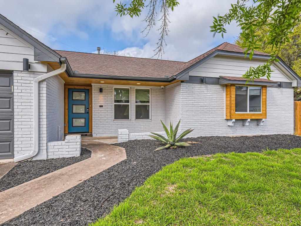 a front view of a house with garage