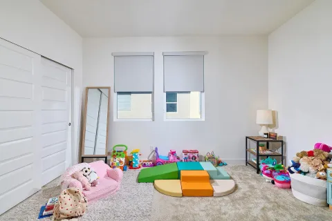a bedroom with toys and a couch