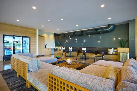 a living room with lots of chairs and a table