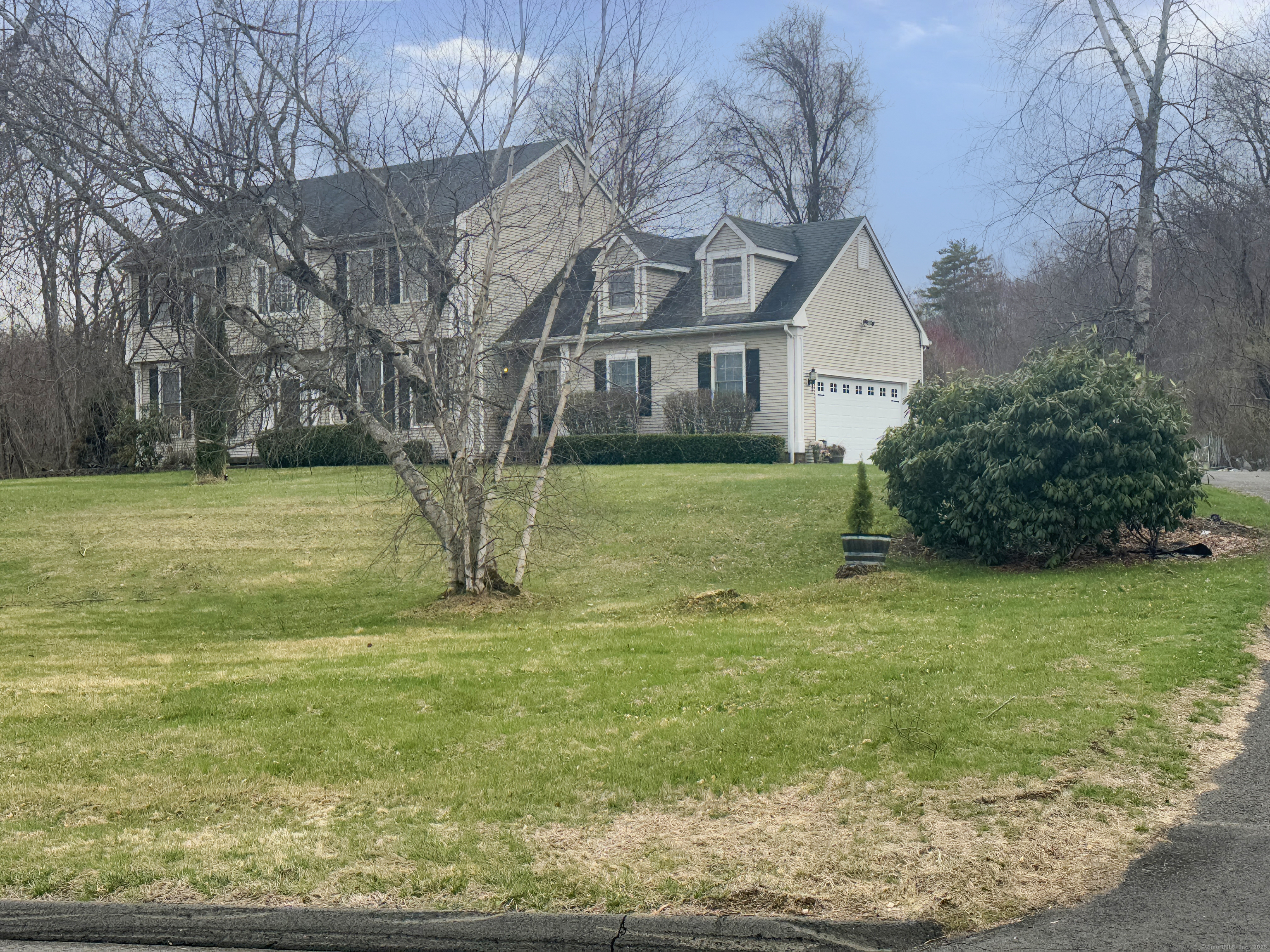 39 Ridge Boulevard East Granby, CT 06026 - Photo 8 of 8 a front view of a house with garden