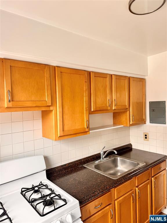 401 West Madison Avenue, Unit 7 Dumont, NJ 07628 - Photo 10 of 15 a kitchen with sink a window and cabinets