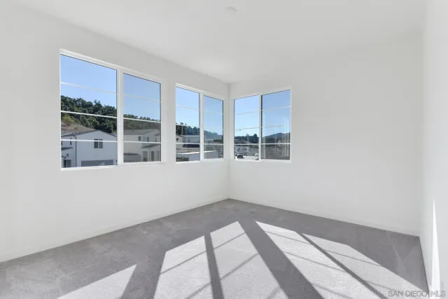 a view of empty room with windows