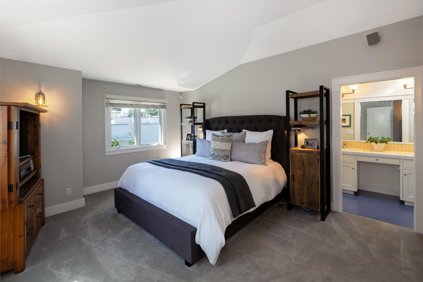 402 Riverview Avenue Capitola, CA 95010 - Photo 11 of 19 a bedroom with a bed and a view of en suite bathroom