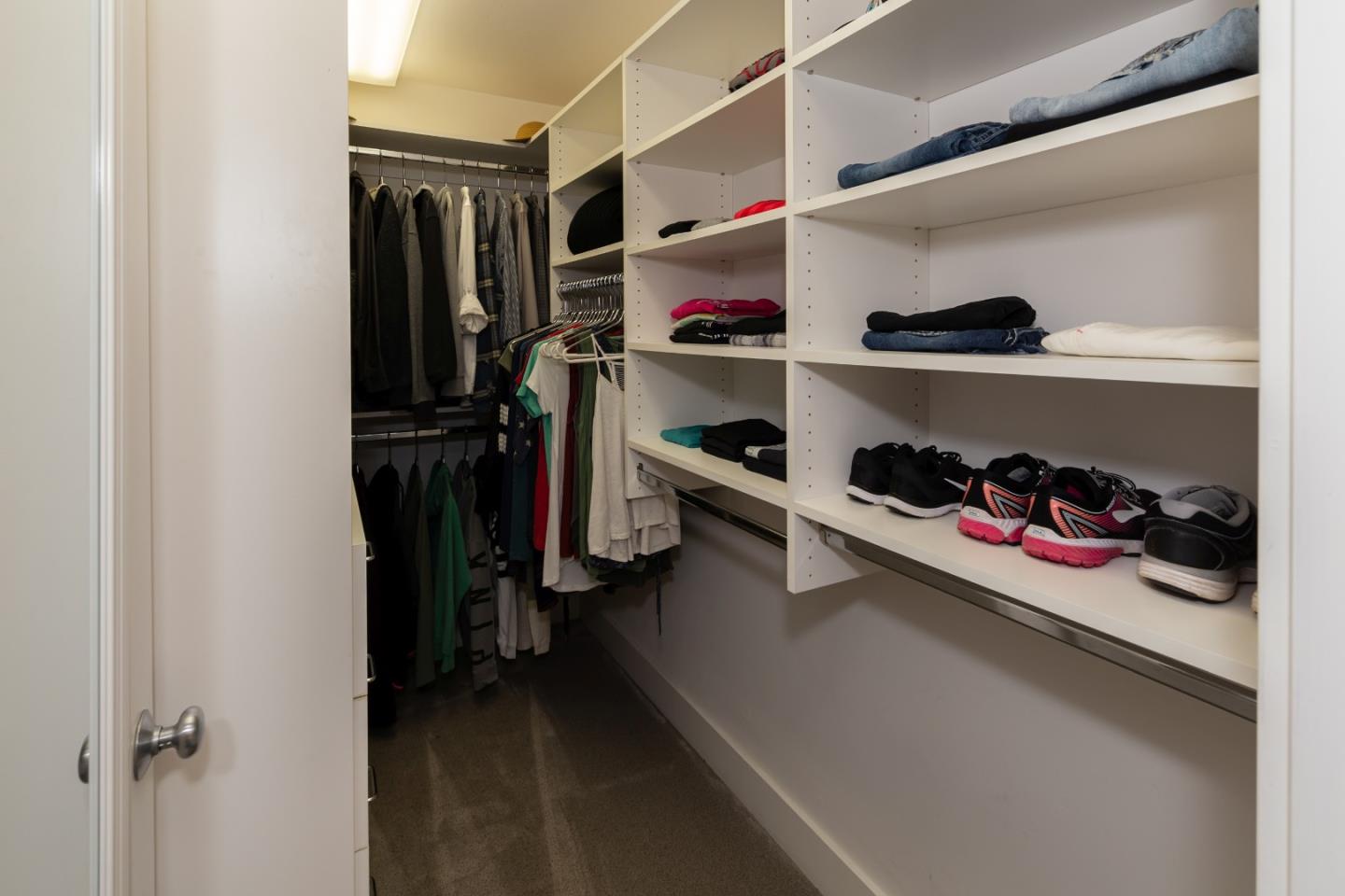 402 Riverview Avenue Capitola, CA 95010 - Photo 12 of 19 a view of walk in closet with clothes and shoes