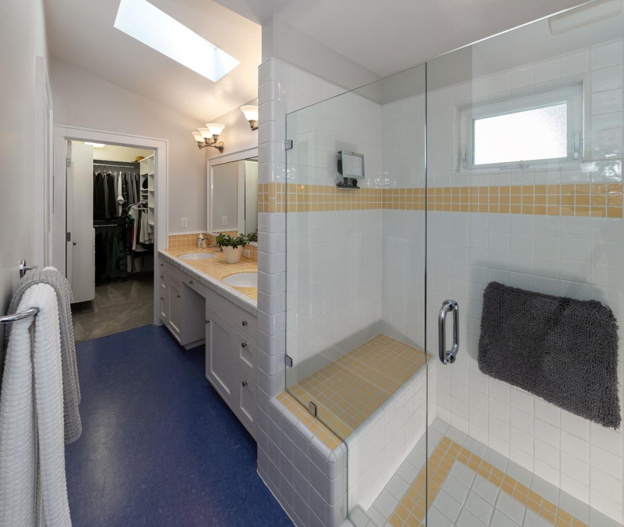 402 Riverview Avenue Capitola, CA 95010 - Photo 14 of 19 a spacious bathroom with a tub sink and mirror