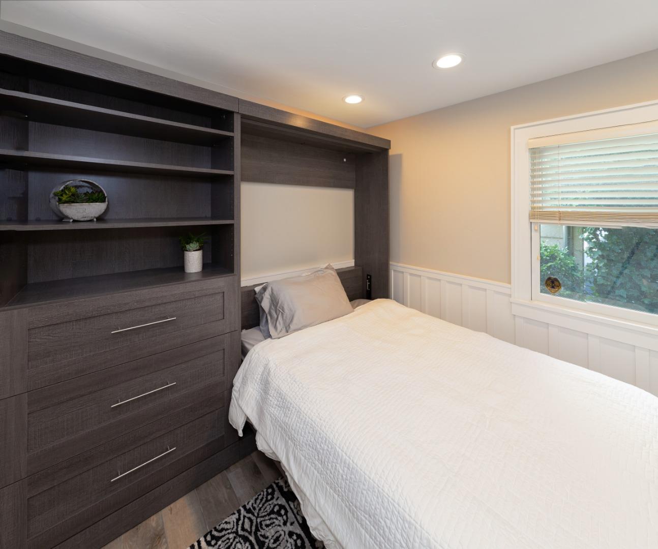 402 Riverview Avenue Capitola, CA 95010 - Photo 15 of 19 a bedroom with a bed and a window