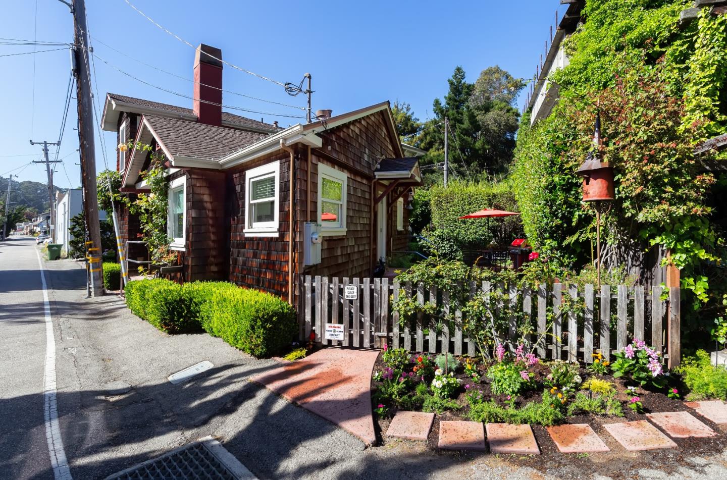402 Riverview Avenue Capitola, CA 95010 - Photo 17 of 19 a front view of a house with a yard
