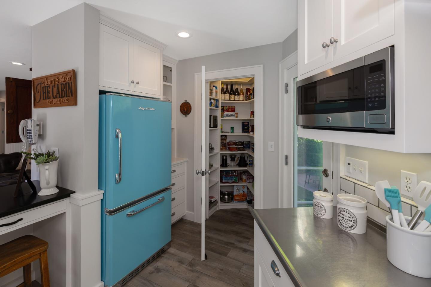 402 Riverview Avenue Capitola, CA 95010 - Photo 5 of 19 a kitchen with stainless steel appliances a microwave a stove and cabinets