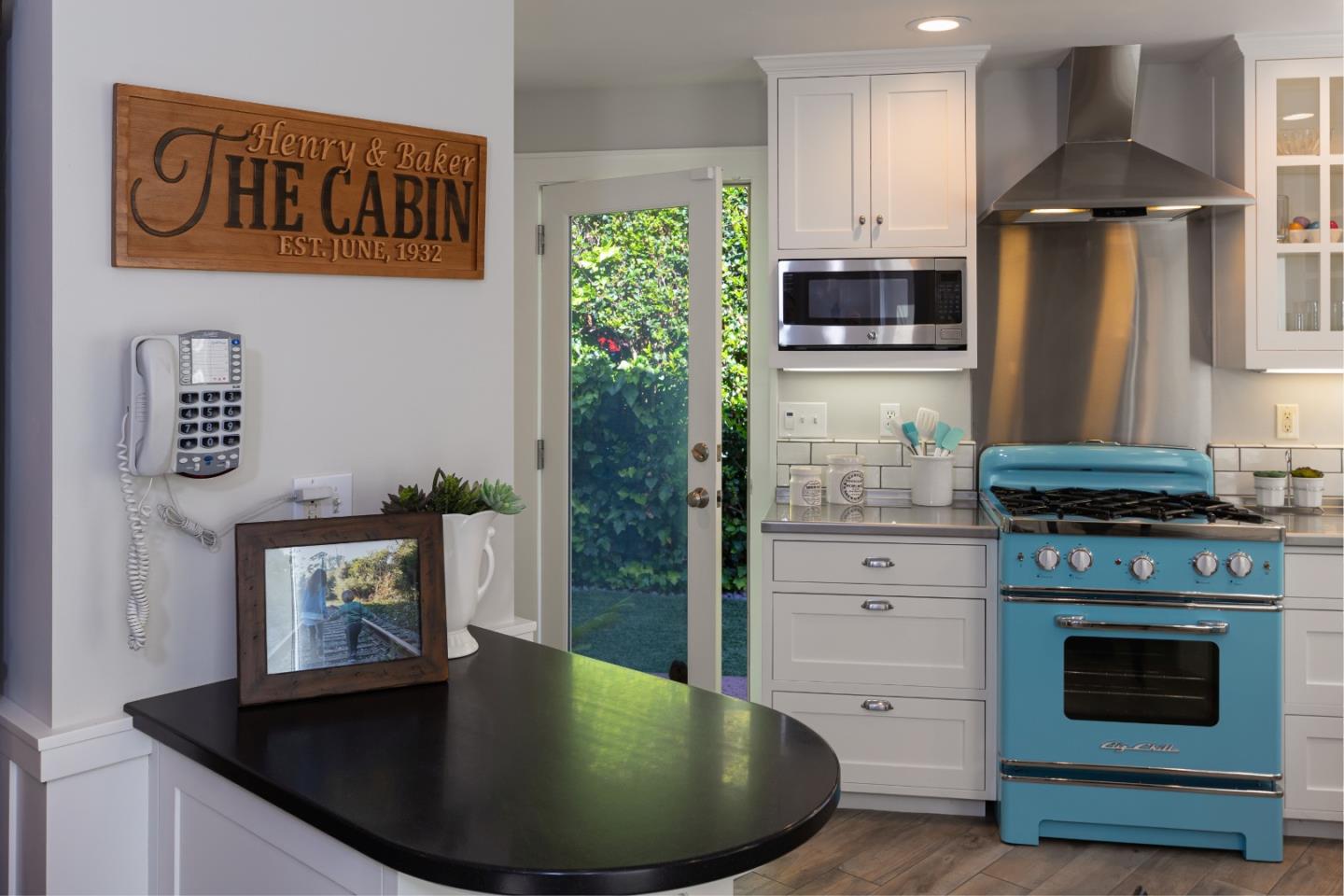 402 Riverview Avenue Capitola, CA 95010 - Photo 6 of 19 a kitchen with stainless steel appliances granite countertop a stove a refrigerator and a microwave