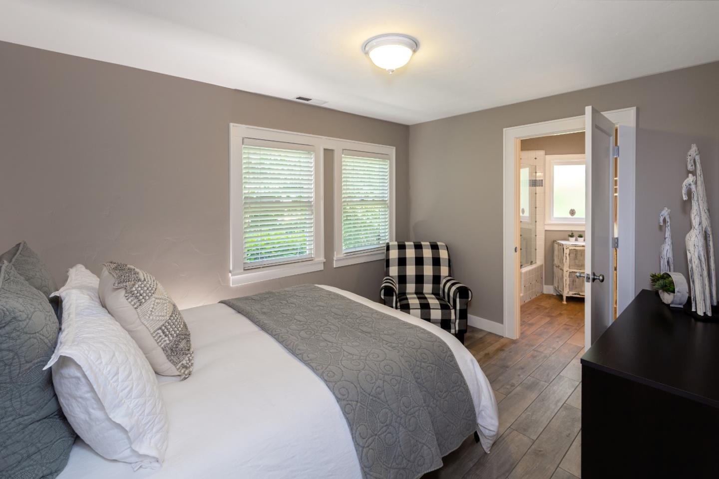 402 Riverview Avenue Capitola, CA 95010 - Photo 8 of 19 a bedroom with a bed and a large window