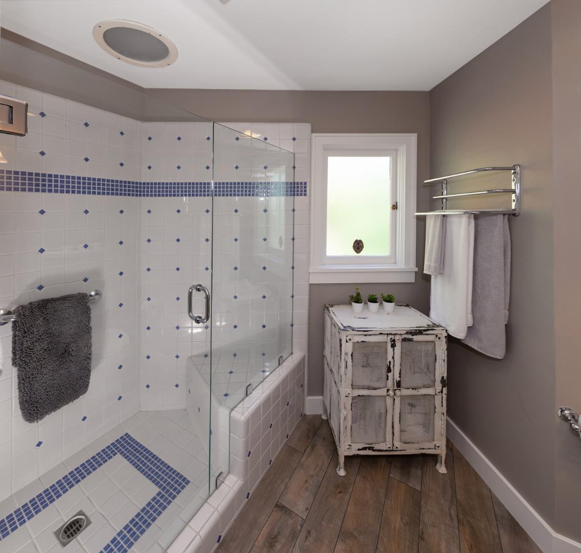 402 Riverview Avenue Capitola, CA 95010 - Photo 9 of 19 a bathroom with a double vanity sink a mirror and shower