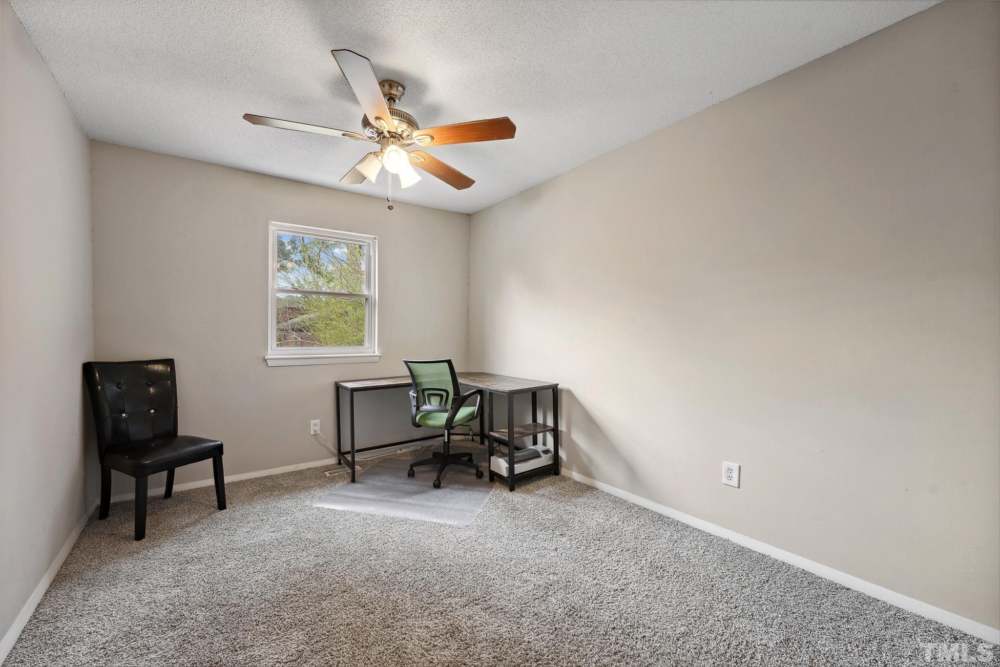 5809 Nottoway Court, Unit B Raleigh, NC 27609 - Photo 17 of 21 a view of a workspace with furniture and a window