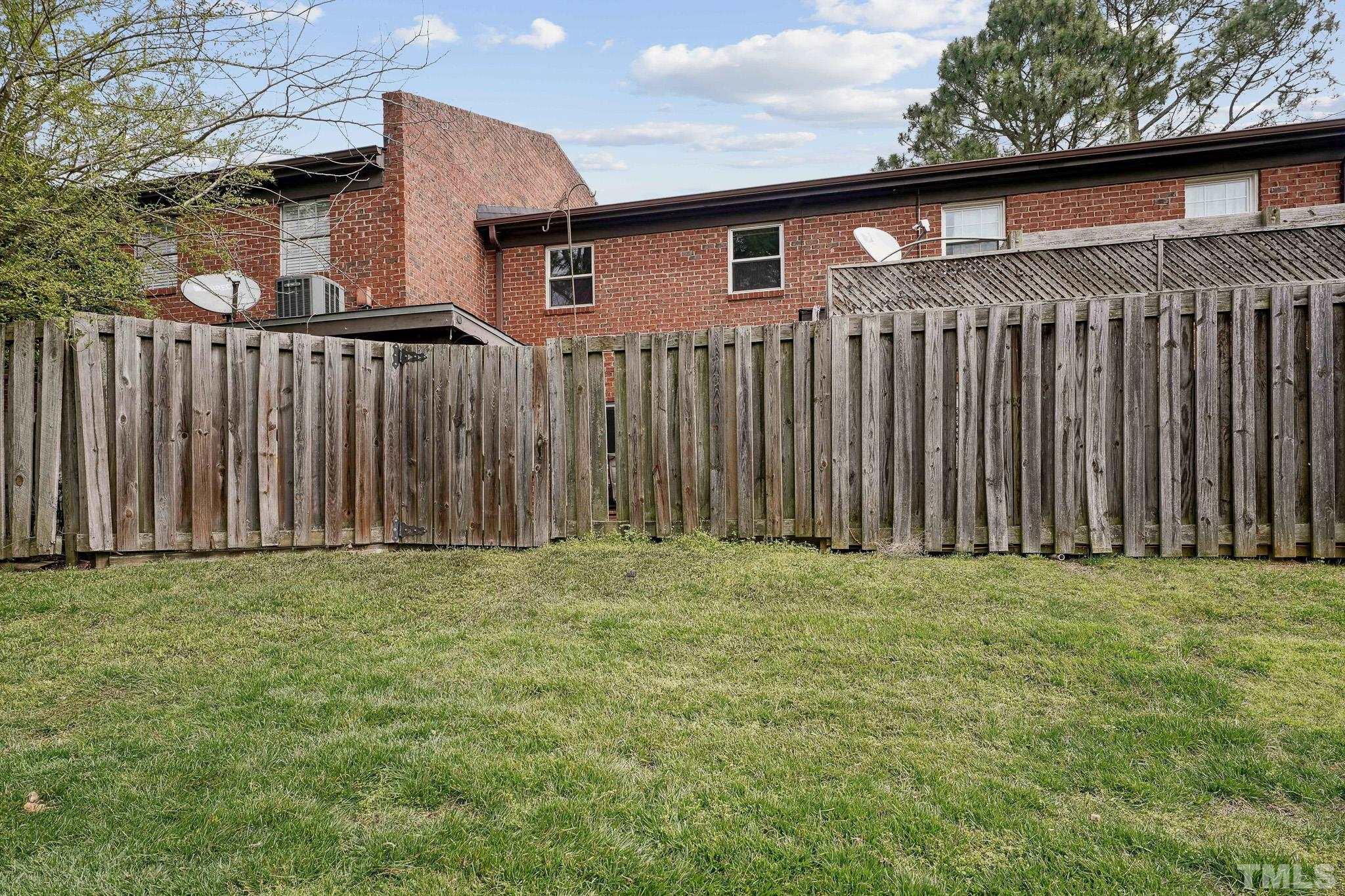 5809 Nottoway Court, Unit B Raleigh, NC 27609 - Photo 20 of 21 a view of a backyard of the house