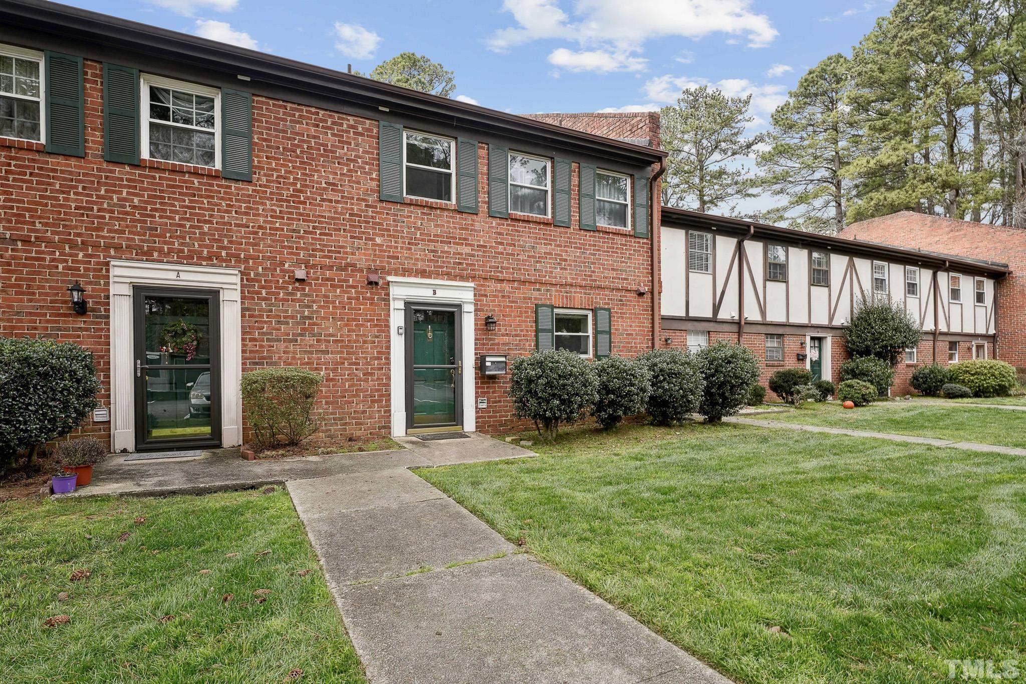 5809 Nottoway Court, Unit B Raleigh, NC 27609 - Photo 3 of 21 a front view of a house with garden