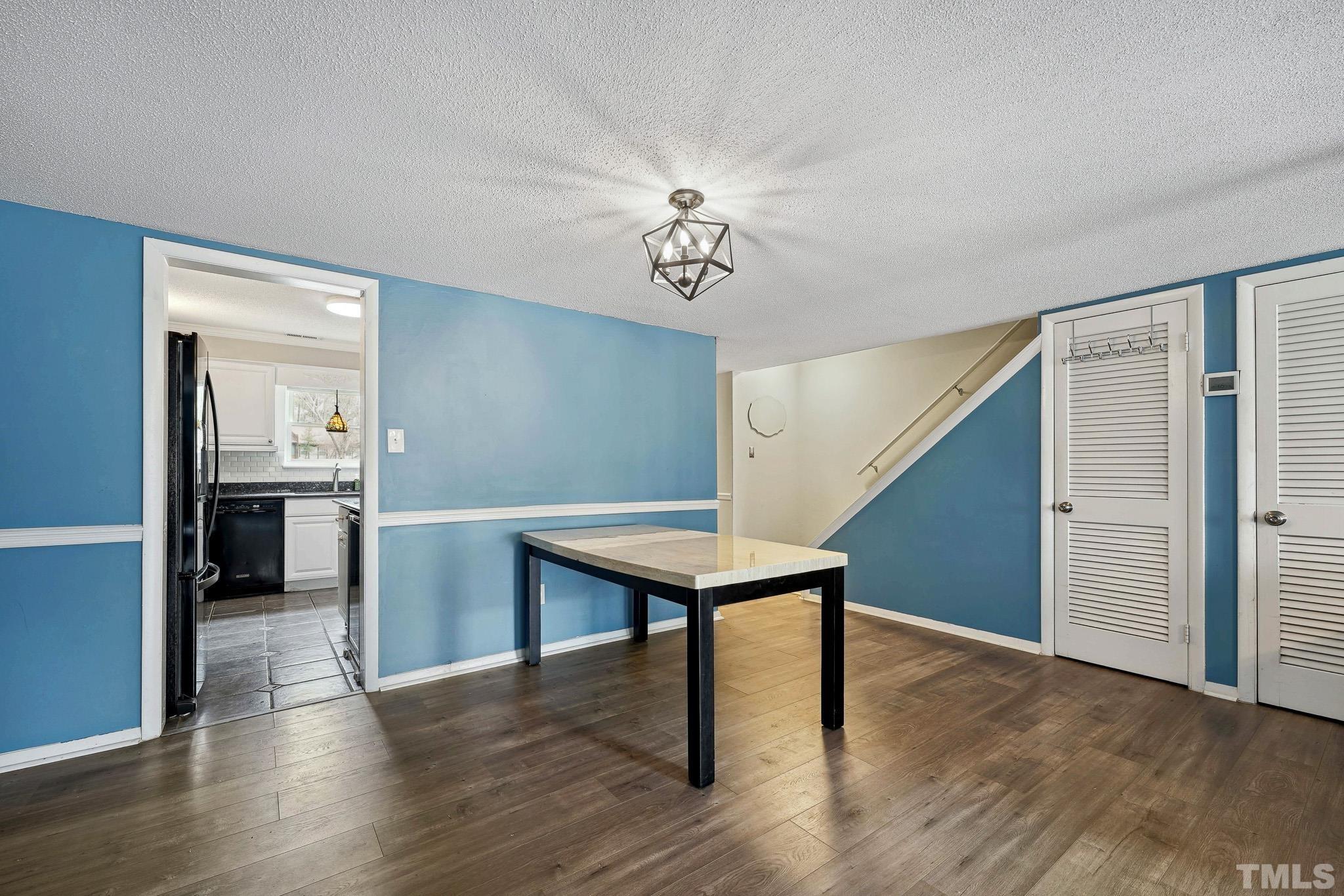 5809 Nottoway Court, Unit B Raleigh, NC 27609 - Photo 5 of 21 a room with furniture and wooden floor