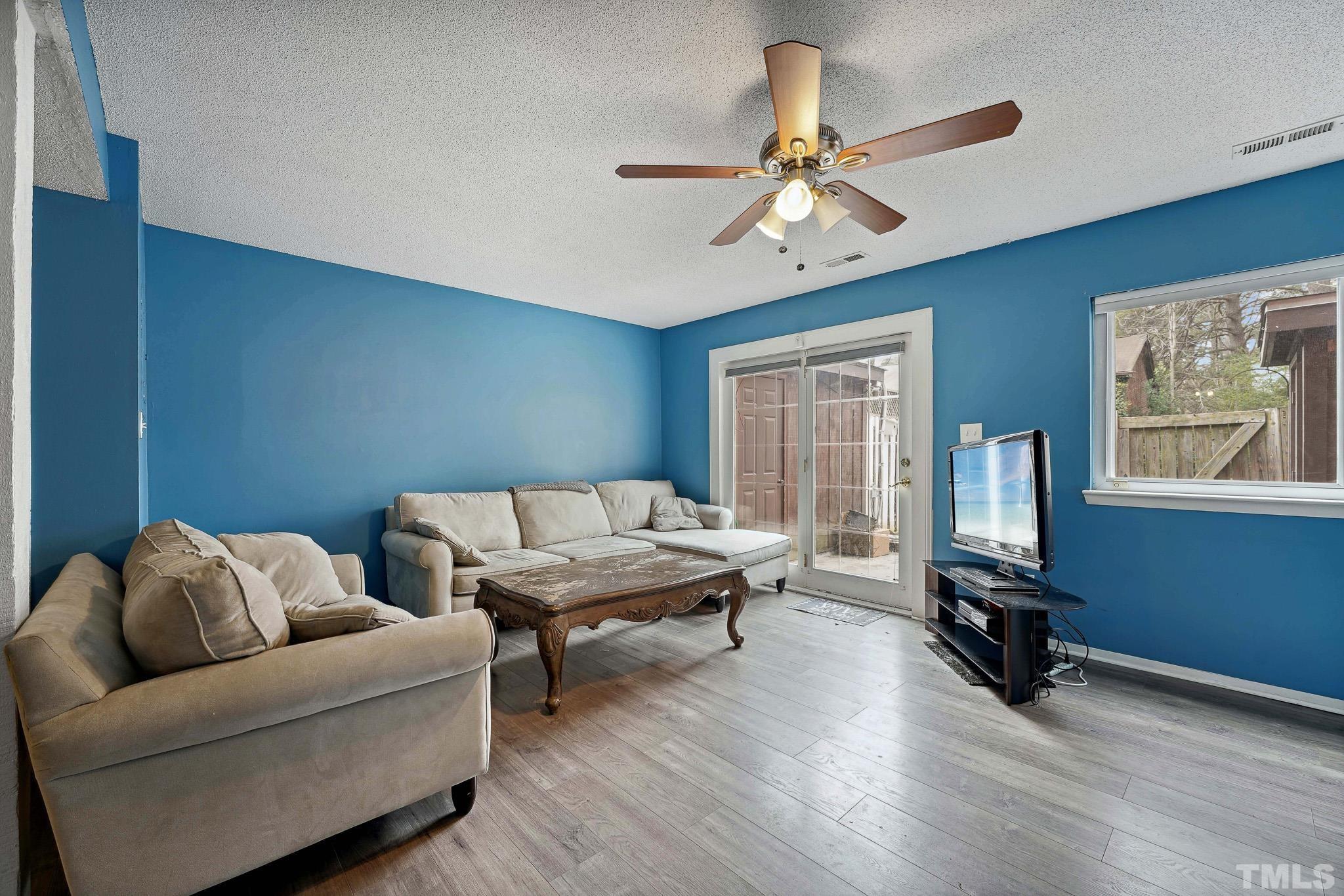 5809 Nottoway Court, Unit B Raleigh, NC 27609 - Photo 6 of 21 a living room with furniture wooden floor and a window