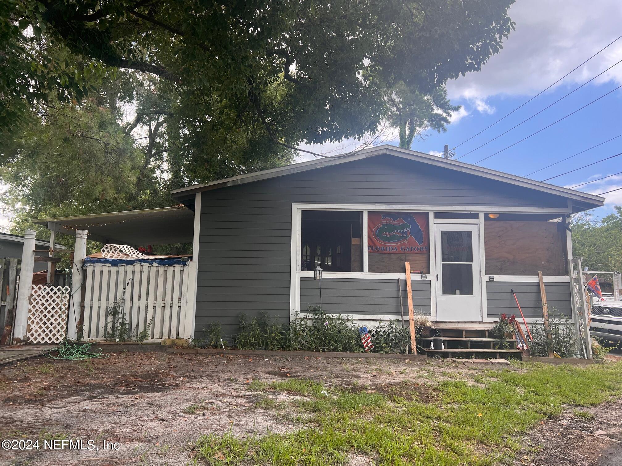 4203 Spring Park Road Jacksonville, FL 32207 - Photo 1 of 19 front view of a house with a yard