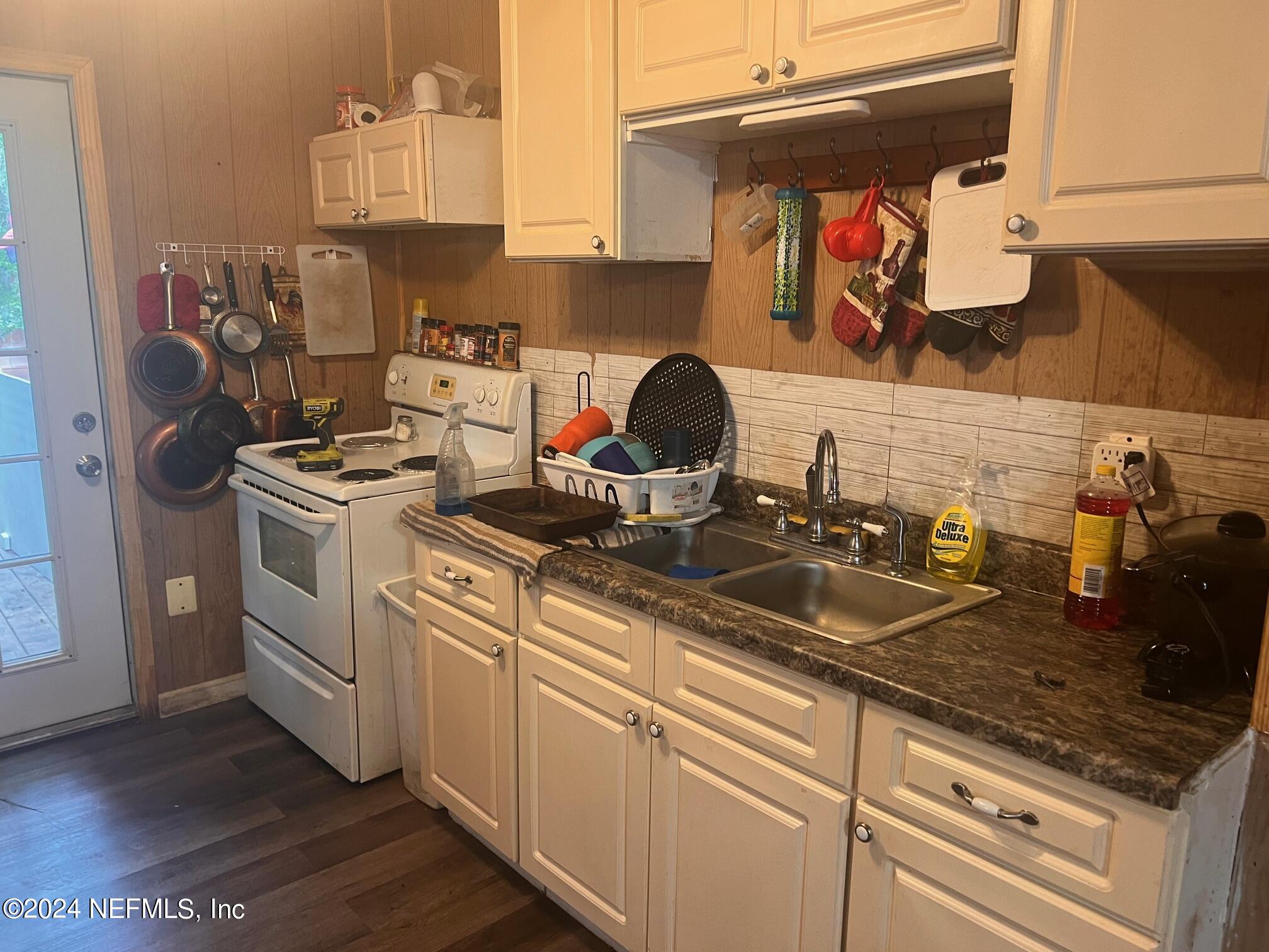 4203 Spring Park Road Jacksonville, FL 32207 - Photo 13 of 19 a kitchen with a sink and cabinets