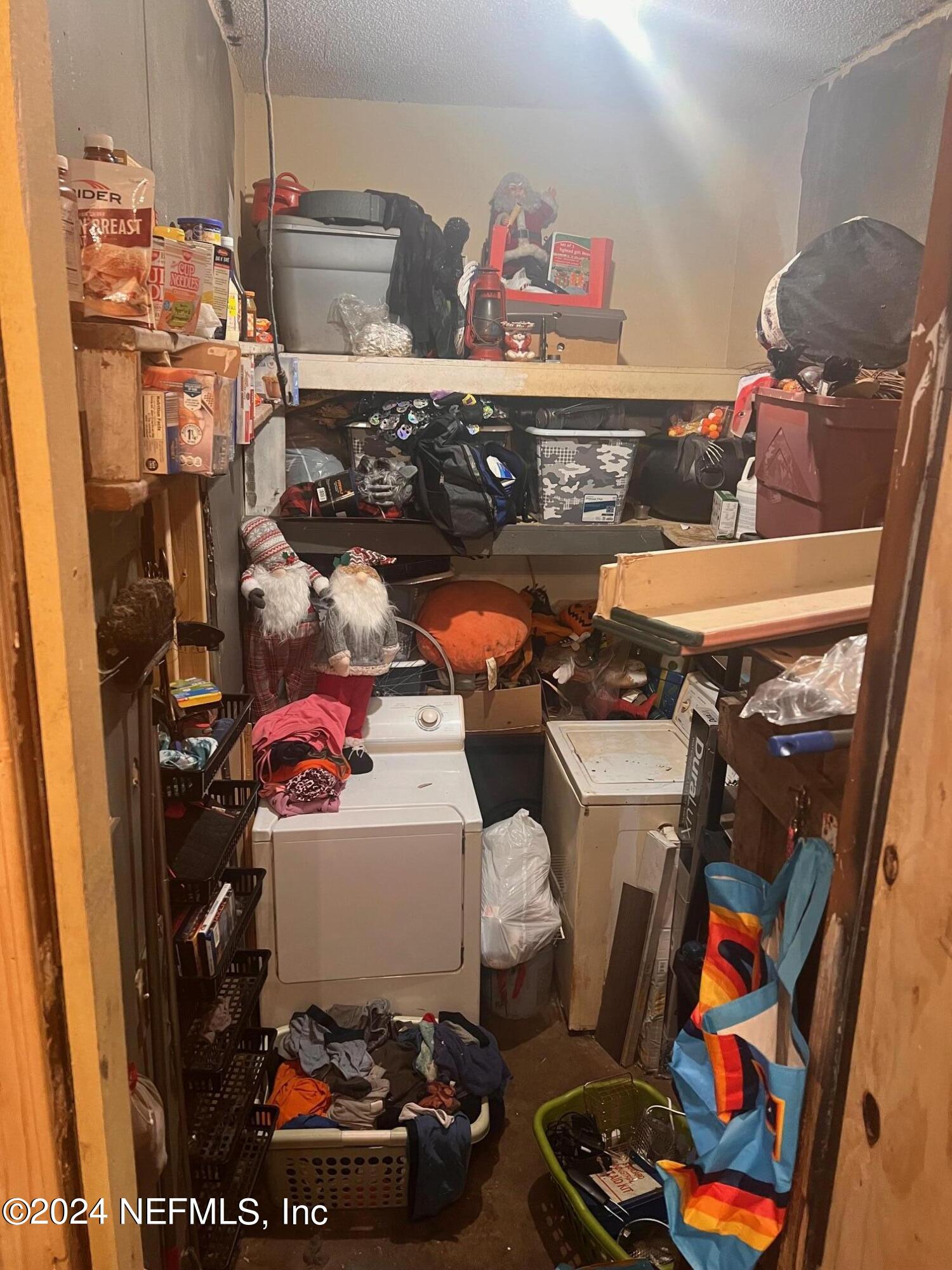 4203 Spring Park Road Jacksonville, FL 32207 - Photo 15 of 19 a room with storage and utility