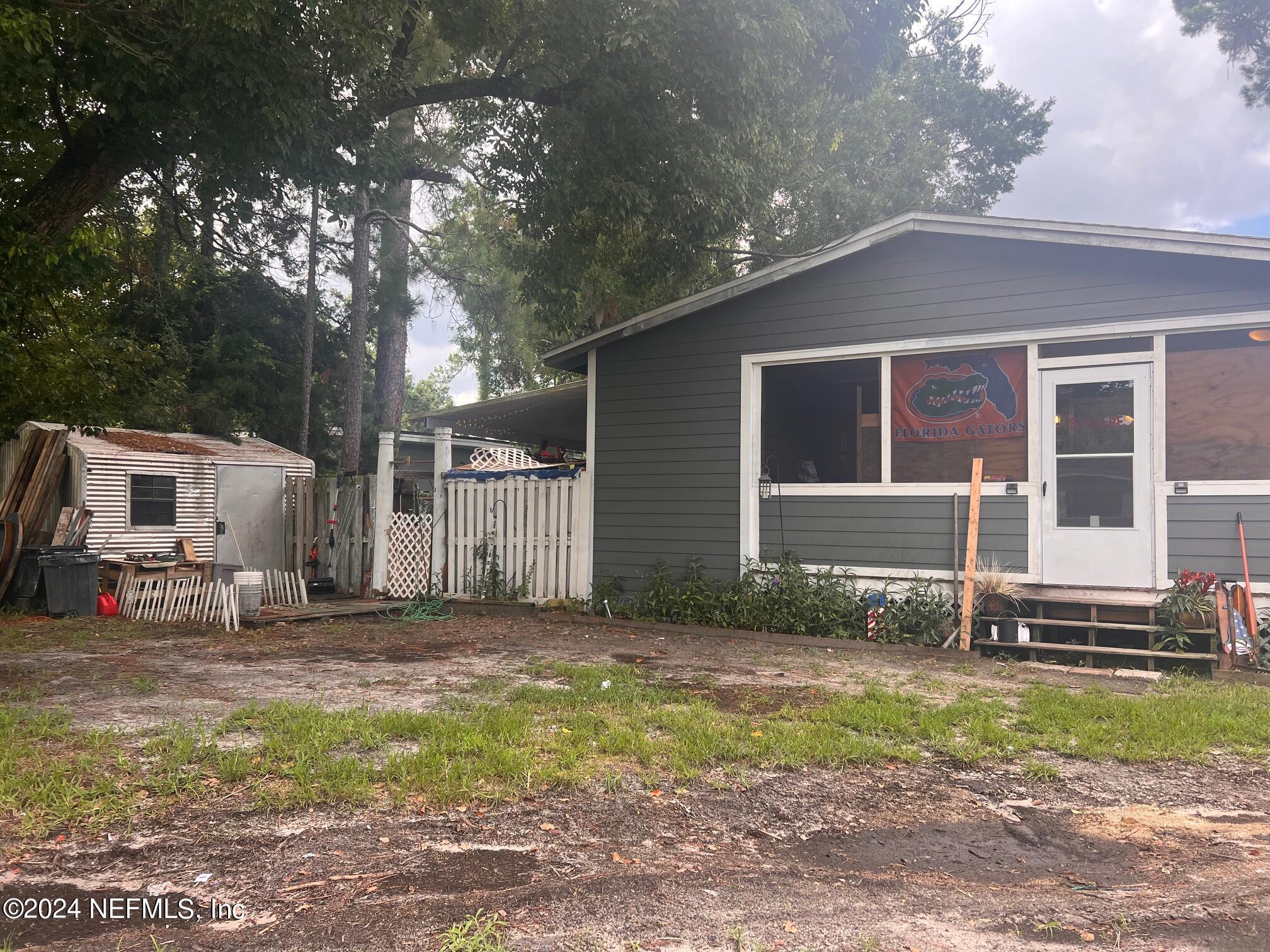 4203 Spring Park Road Jacksonville, FL 32207 - Photo 2 of 19 a front view of a house with a yard