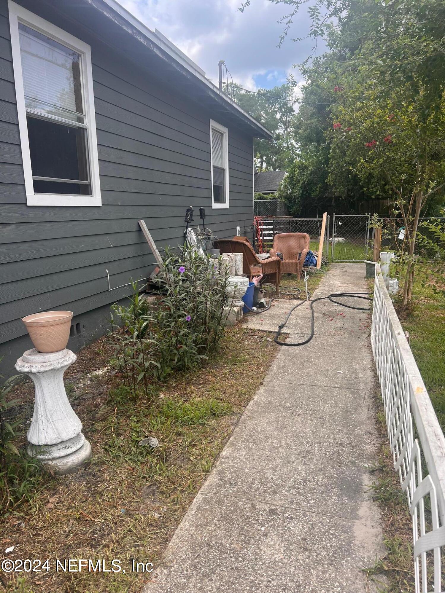 4203 Spring Park Road Jacksonville, FL 32207 - Photo 3 of 19 a view of a chairs and table in backyard of the house