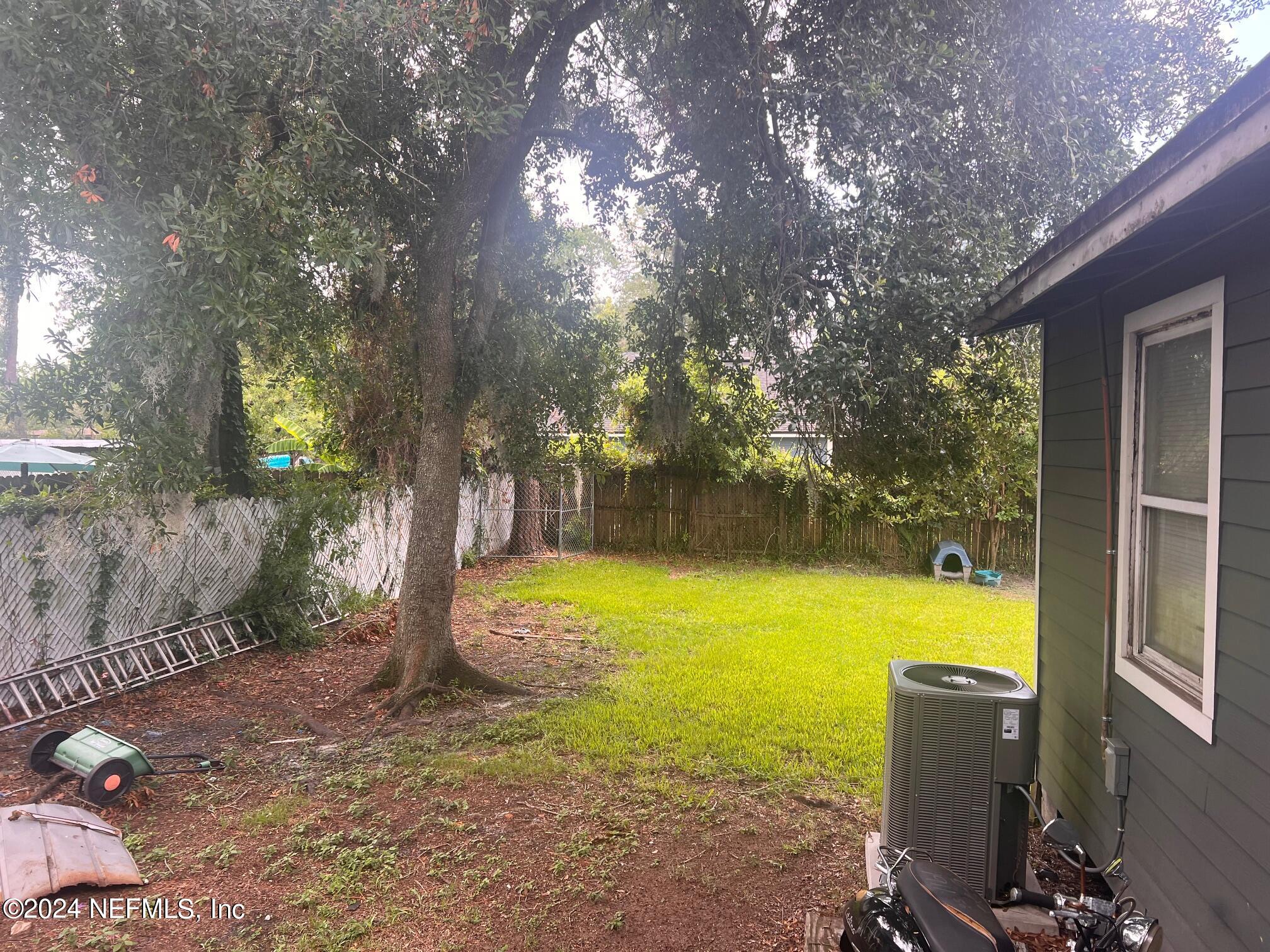 4203 Spring Park Road Jacksonville, FL 32207 - Photo 5 of 19 a view of a swimming pool with an outdoor space and seating area