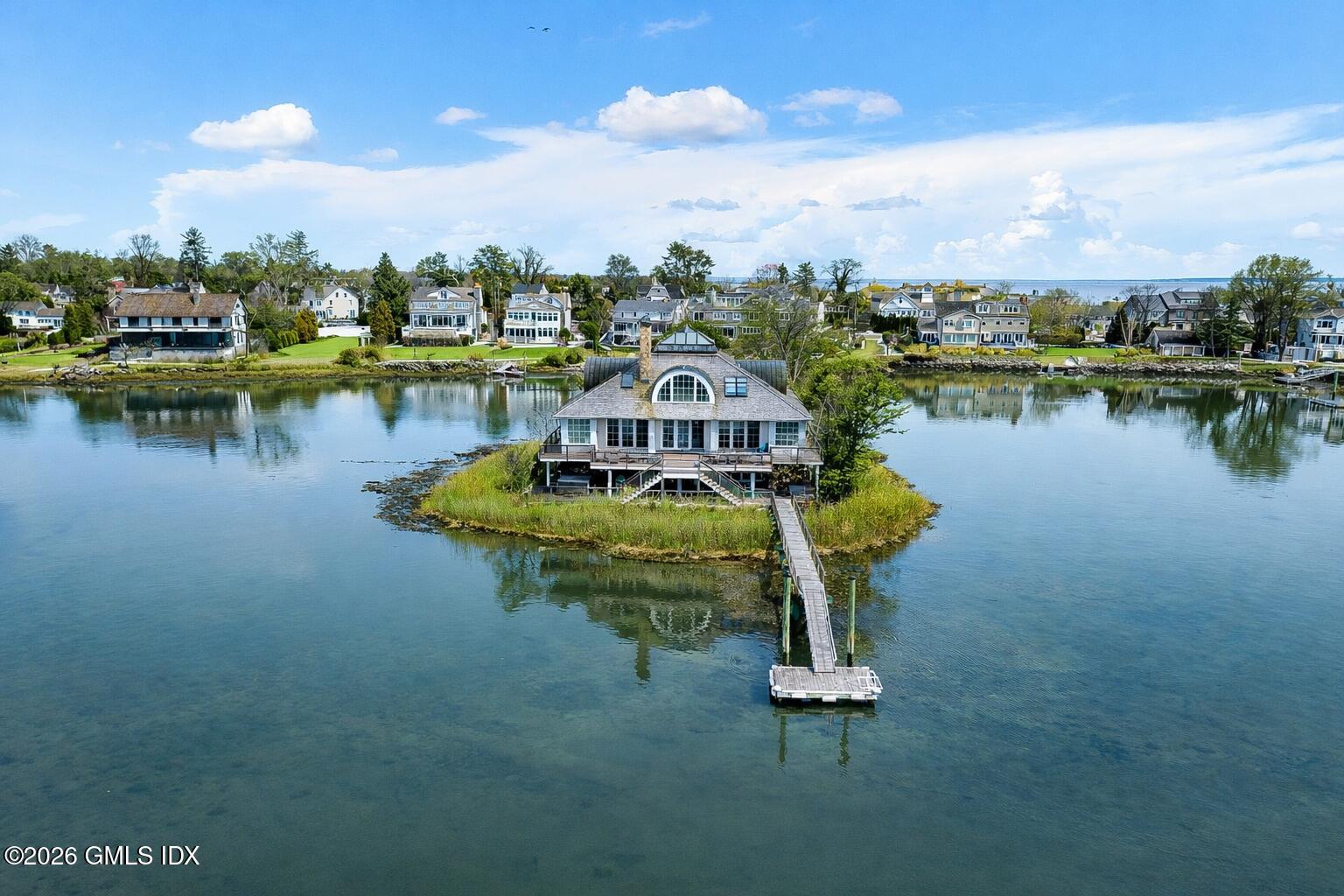 189 Shore Road Old Greenwich, CT 06870 - Photo 1 of 38 a view of a lake with a city