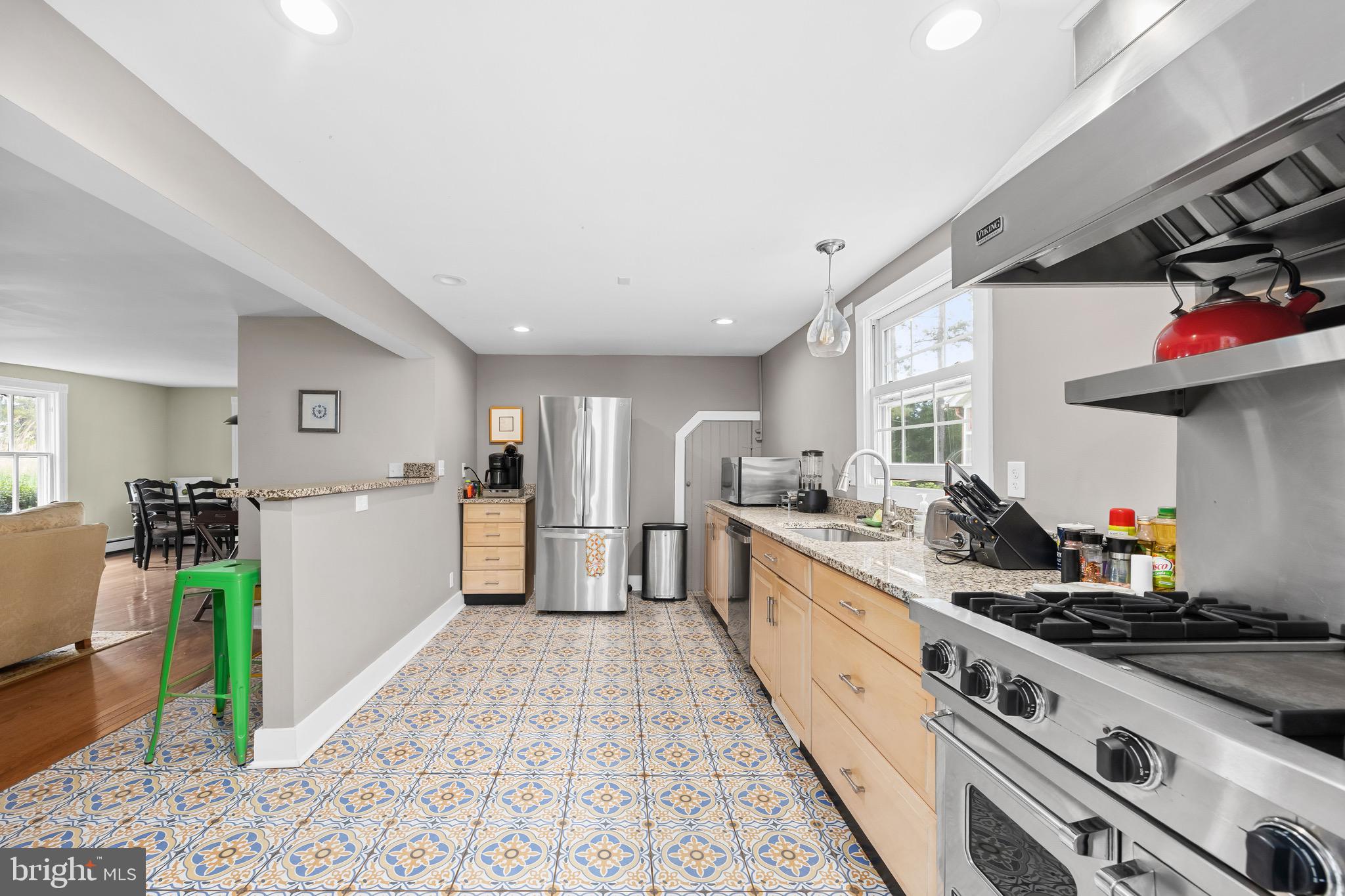 2712 Cinder Lane Quantico, MD 21856 - Photo 13 of 100 a large kitchen with stainless steel appliances granite countertop a lot of counter space and wooden floors