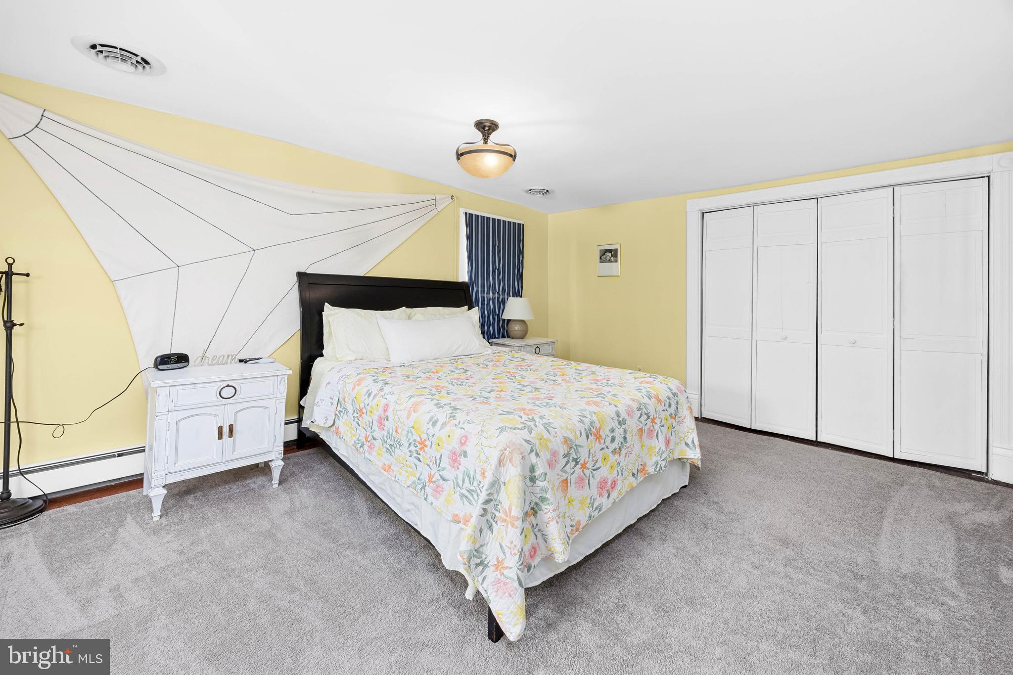 2712 Cinder Lane Quantico, MD 21856 - Photo 50 of 100 a bed sitting in a room next to a lamp