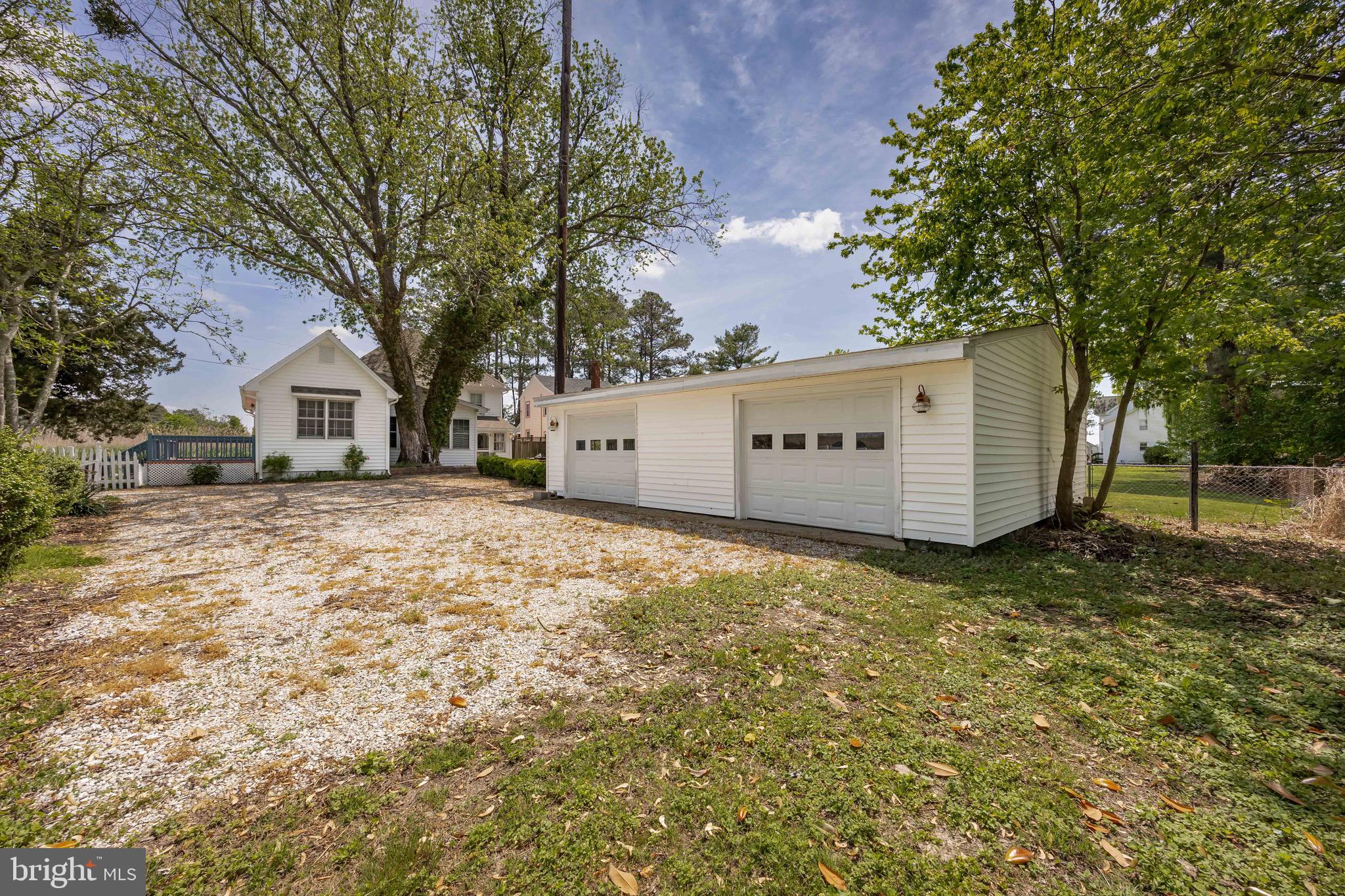 2712 Cinder Lane Quantico, MD 21856 - Photo 79 of 100 a view of a white house with a yard and large trees
