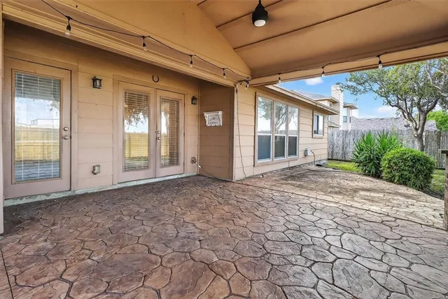 a view of a backyard of the house