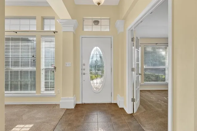 a view of a hallway with wooden shelves