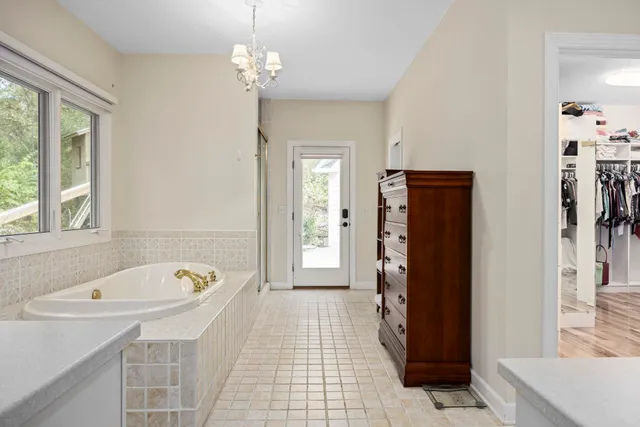 a living room with furniture and a dresser