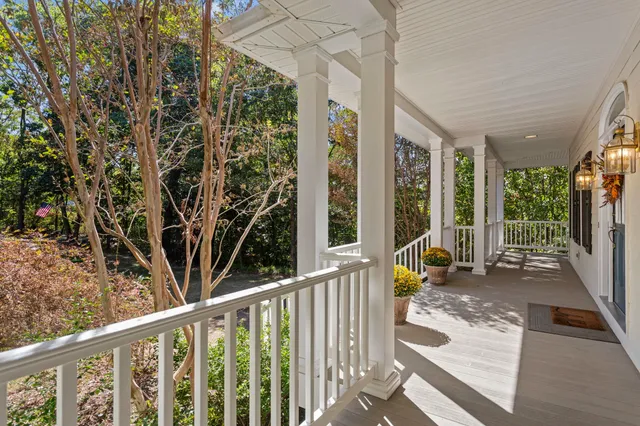a view of a house with wooden fence