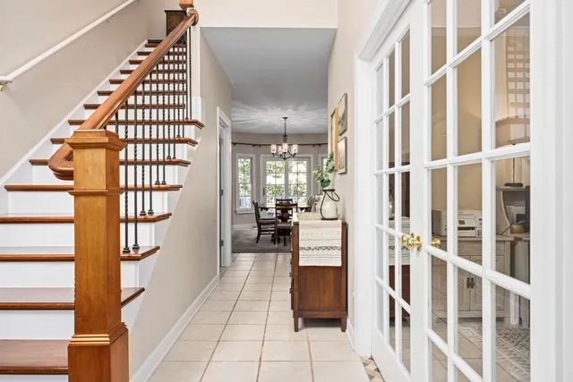 a view of entryway and hall with wooden floor