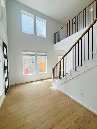 a view of an entryway with wooden floor