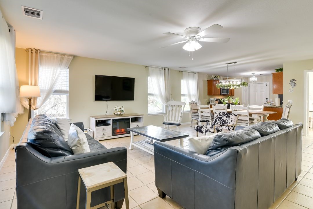 1206 4th Street Seabrook, TX 77586 - Photo 3 of 15 a living room with furniture and a flat screen tv